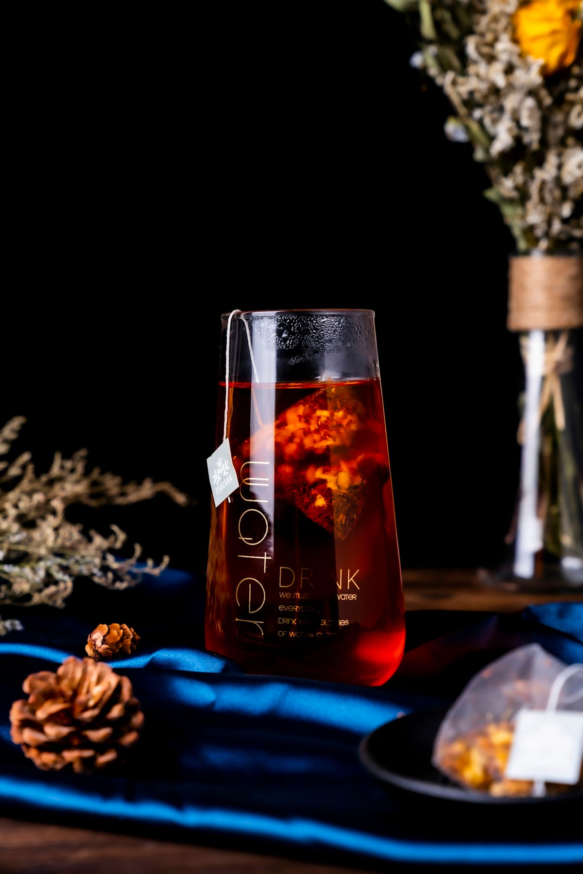 red wine bottle on blue textile