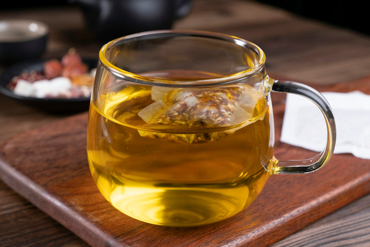 clear glass mug with yellow liquid