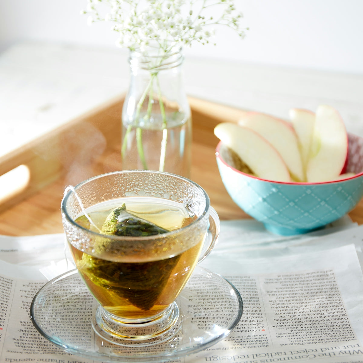 a glass cup of tea on a table