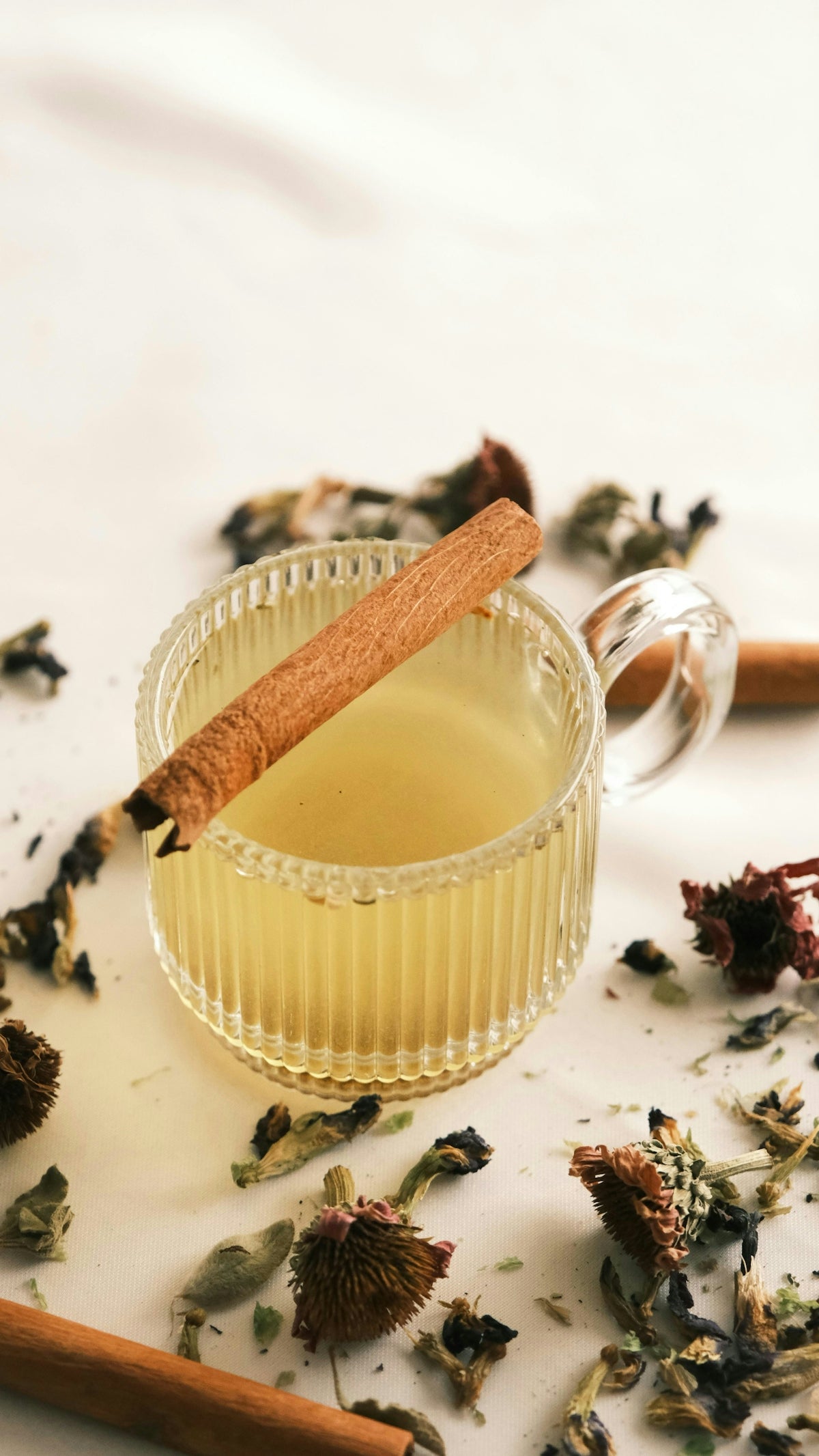 A cup of tea with a cinnamon stick in it